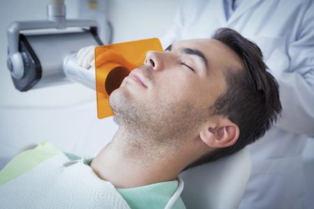 Calm patient relaxing during sedation dentistry treatment